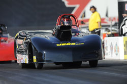 Jason Kenny races along side his father, Alan Kenny in the NHRA Super Comp class