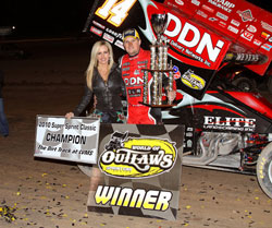 Meyers in victory lane after history making come from behind win (far as we know that's not lady luck next to them)