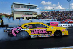 Jeg Coughlin earned a victory at the 26th annual O'Reilly NHRA Spring Nationals in spite of a parachute malfunction.