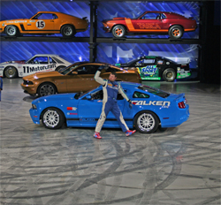 Gittin drove in front of a backdrop of classic Mustangs displayed in rafters like a Matchbox set