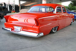 The bright red paint on Kent Ladners 1955 Plymouth Belvedere drew SEMA fans for a closer look.