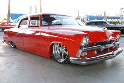 What catches your attention after the paint job is that the SEMA 1955 Plymouth Belvedere appears to rest on the ground.