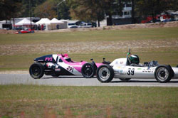 Kim Madrid driving the hot-pink Formula Vee, and sporting her trademark pink Mohawk helmet, won the race in Georgia.