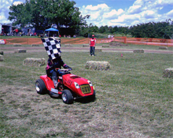 Cutting blades are removed on the lawn mower racing circuit, there are no cash prizes and racers compete for bragging rights