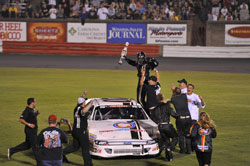 Corey LaJoie and his team celebrating their victory.