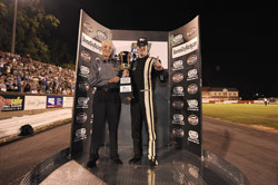 Corey LaJoie being presented with the 1st place trophy.