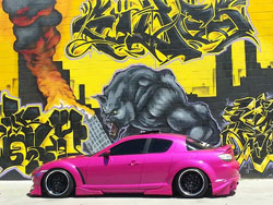 The candy pink exterior paint of Lina Rodriguez's 2004 Mazda RX-8 demands your attention no matter where it's at.