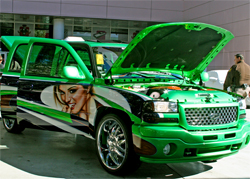 Matt Andrews Airbrushing put on the final touches of the beautiful models on the Lucky Luciano GMC Sierra