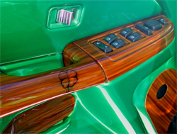 Four leaf clover and wood show off door panel on the 2005 GMC Sierra Crew Cab modified by Lucky Luciano Customs