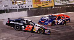 Michael Self spins during NASCAR K&N Pro Series West race with Dylan Lupton right behind him.