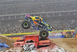Monster Jam's Black Stallion puts air under his truck at Reliant Stadium. photo by Kenny Lau