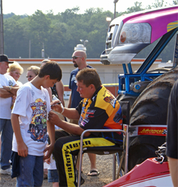 Black Stallion owner driver Michael Vaters signs autographs at the pit party
