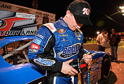 Justin Haley autographs the K&N mini helmet after his win at Greenville Pickens Speedway