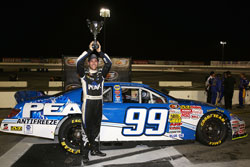 Patrick Staropoli holds his trophy up high for all his fans to see at Irwindale Speedway NAPA Auto Parts 150.