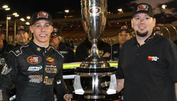 Tony Yorkman (right), head of sports marketing for K&N, presented the NASCAR K&N Pro Series West championship to Dylan Kwasniewski last year at Phoenix. Kwasniewski, one of the sport's rising stars, has a chance to become the first driver to win both the K&N Pro Series West and East titles in successive years. Getty Images.