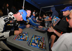 Eric Holmes (right) and Chase Briscoe (left) sign autographs at the Napa Speedway before NASCAR K&N Pro Series West race