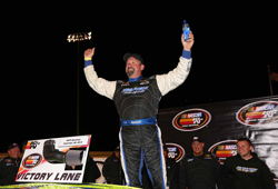 NASCAR K&N Pro Series West racer Greg Pursley celebrates his win at Napa Speedway