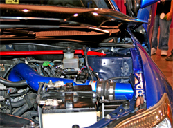 K&N air intake system in blue is a good color match for the 2006 Scion tC's custom paint job