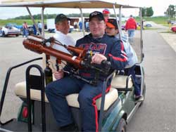 Brad Springer prepares to shoot t-shirts into the Angola Speedway grandstands with a t-shirt launcher.