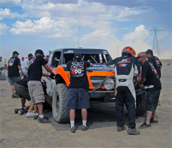 Team Jefferies pit crew works on the K&N Trophy Truck during a break in the grueling 276 mile SCORE Primm 300