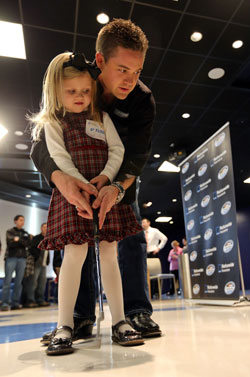 NASCAR Nationwide Series Champ Ricky Stenhouse Jr. plays putts with patient Taylor Rockwell