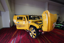 Sergio and his son picked out a huge set of Lexani Dial wheels for their custom Hummer and had the inserts painted to match. Photo at SEMA 2012.