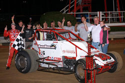 Kody and Tanner with their entire 6R racing team celebrating in Victory Lane.
