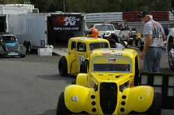 Hughes drives the No. 83 car, a 1934 Ford coupe, and teammate Mike Weddell drives the 1934 Ford sedan.