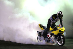 Brian Bubash performs motorcycle burnout