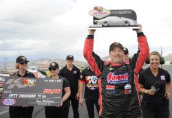 Greg Anderson lifts the trophy and celebrates at the K&N HPC