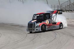 Mike Ryan drifting his Freightliner truck around the banks of Irwindale Speedway