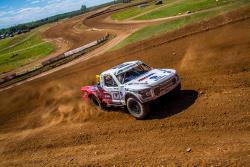 Andrew Carlson races an off-road track at a TORC series event