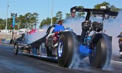 Kathy Fisher's 2015 American dragster completes a burnout.