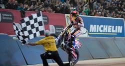 Marc Marquez wheelies past the checkered flag for the Sperprestigio win