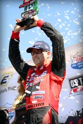 Carl Renezeder celebrating another win on top of the podium after a Lucas Oil Off Road Series Race