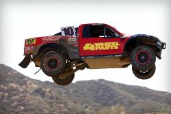 Greg Adler jumping his Pro4 race truck in the Lucas Oil Off Road Racing Series