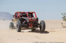 Shot of the Murray Racing Team's Can-Am X3 w/ fully compressed shocks at Best in the Desert V2R