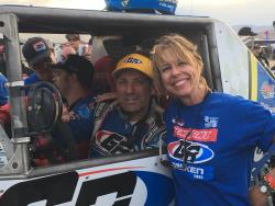 Photo of Tony and Debbie Pellegrino post race next to the Unlimited Class Ultra4 Car