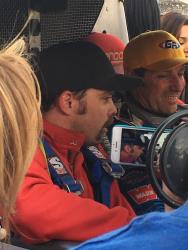 Photo of Co-Driver Christopher Rea being interviewed in the car with Tony Pellegrino