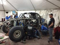 Photo of Team GenRight putting the transmission back into the Ultra4 car
