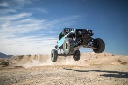 Photo of Vaughn launching "Brocky" in the desert checking out the suspension.