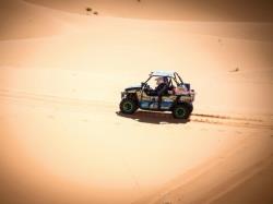 Photo of Sara and Erica driving across the desert in the Rallye Aïcha des Gazelles du Maroc