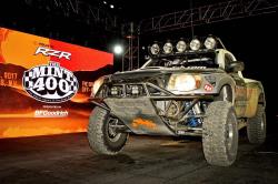 Photo of the Total Chaos truck on the podium at the finish of the race.