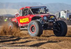 Photo of the Ultra4 Car #4444 speeding past the spectators as they head into their third lap