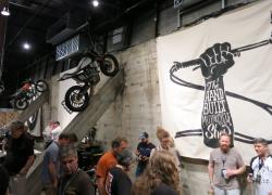 Motorcycles on the wall at the Handbuilt Motorcycle Show at the Fair Market in Austin, Texas