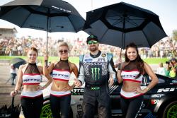 Vaughn Gittin Jr. poses with the Nitto Tire umbrella girls prior to the Top 16 opening ceremonies