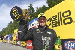 Alex Laughlin holding his Wally at the NHRA Thunder Valley Nationals in Bristol, Tennessee
