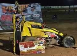 Hodges celebrates win in preliminary feature at the "Western World" at USA Raceway in 2015