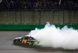 Martin Truex Jr doing a burnout at NASCAR Monster Energy Race at Kentucky Speedway 