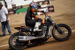 The Harley-Davidson is heavy and difficult to handle versus the lightweight speedway bikes